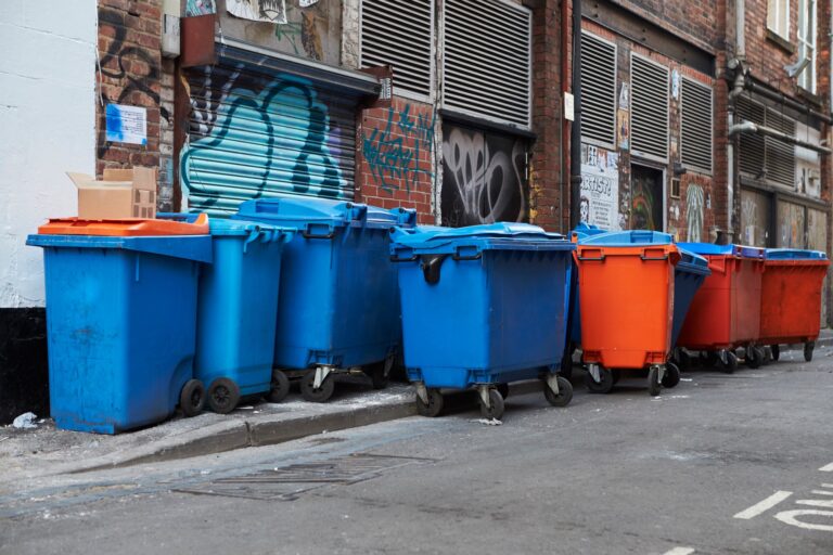 Manchester, UK - 10 May 2017: Group Of Wheelie Bins In Manchester Street